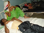Torture victim Nijammudin on hospital bed